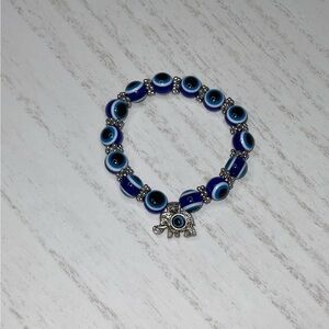 Evil eye bracelet with‎ elephant pendant